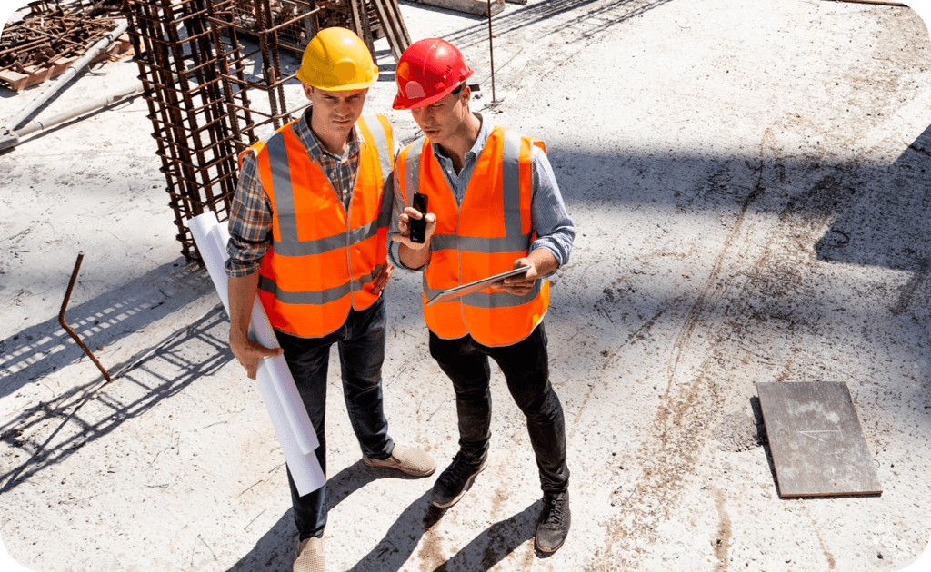 Two men holding clipboards in high-vis